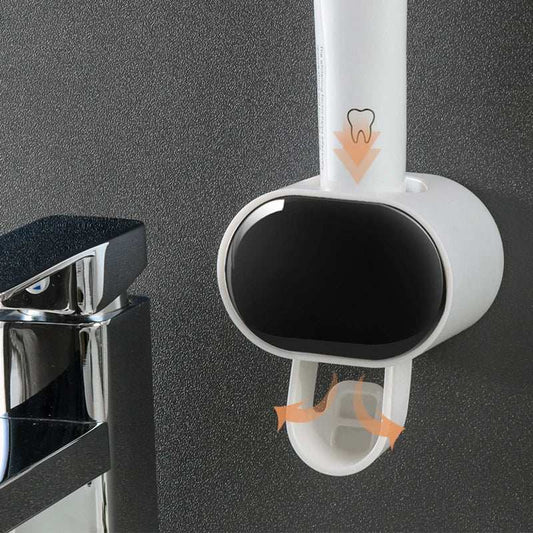 automatic toothpaste dispenser mounted on bathroom wall with toothpaste tube inserted