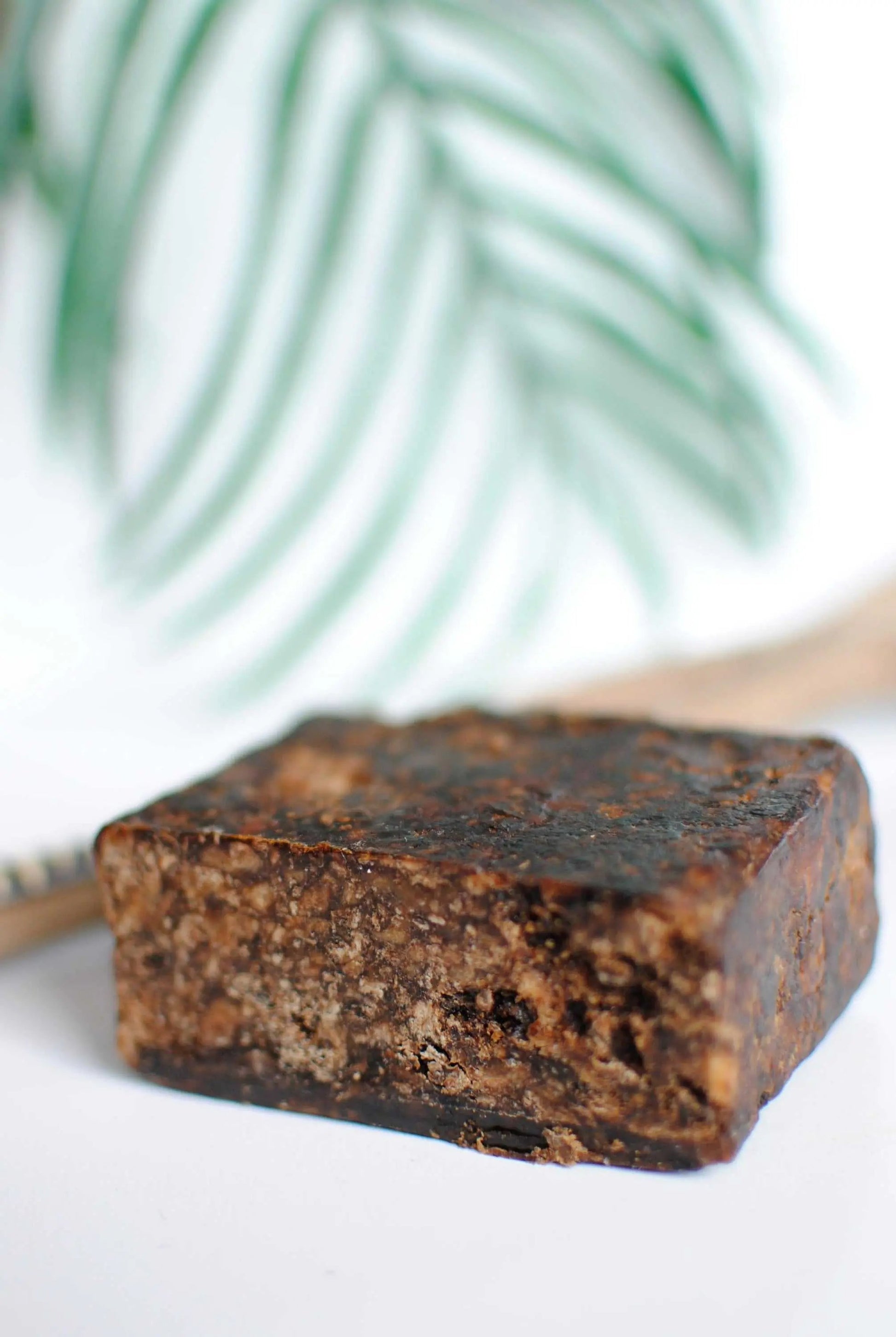 Natural handcrafted African Black Soap bar with organic shea butter for skin cleansing and nourishment