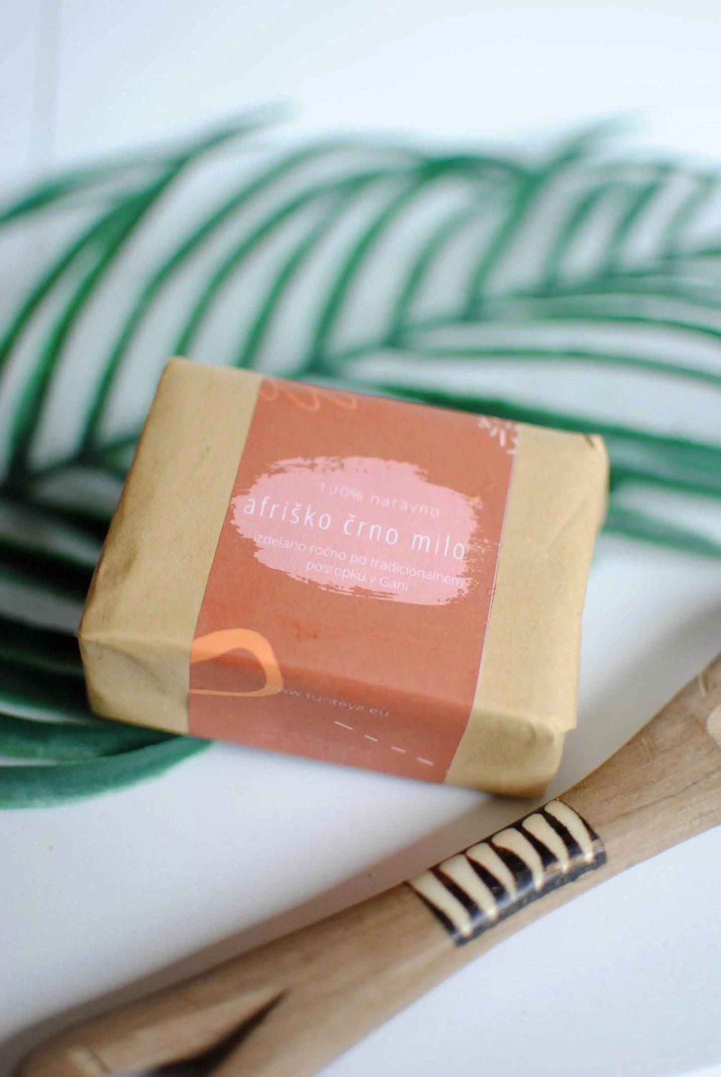 Handcrafted African Black Soap with organic shea butter for moisturizing and treating skin conditions like acne and psoriasis