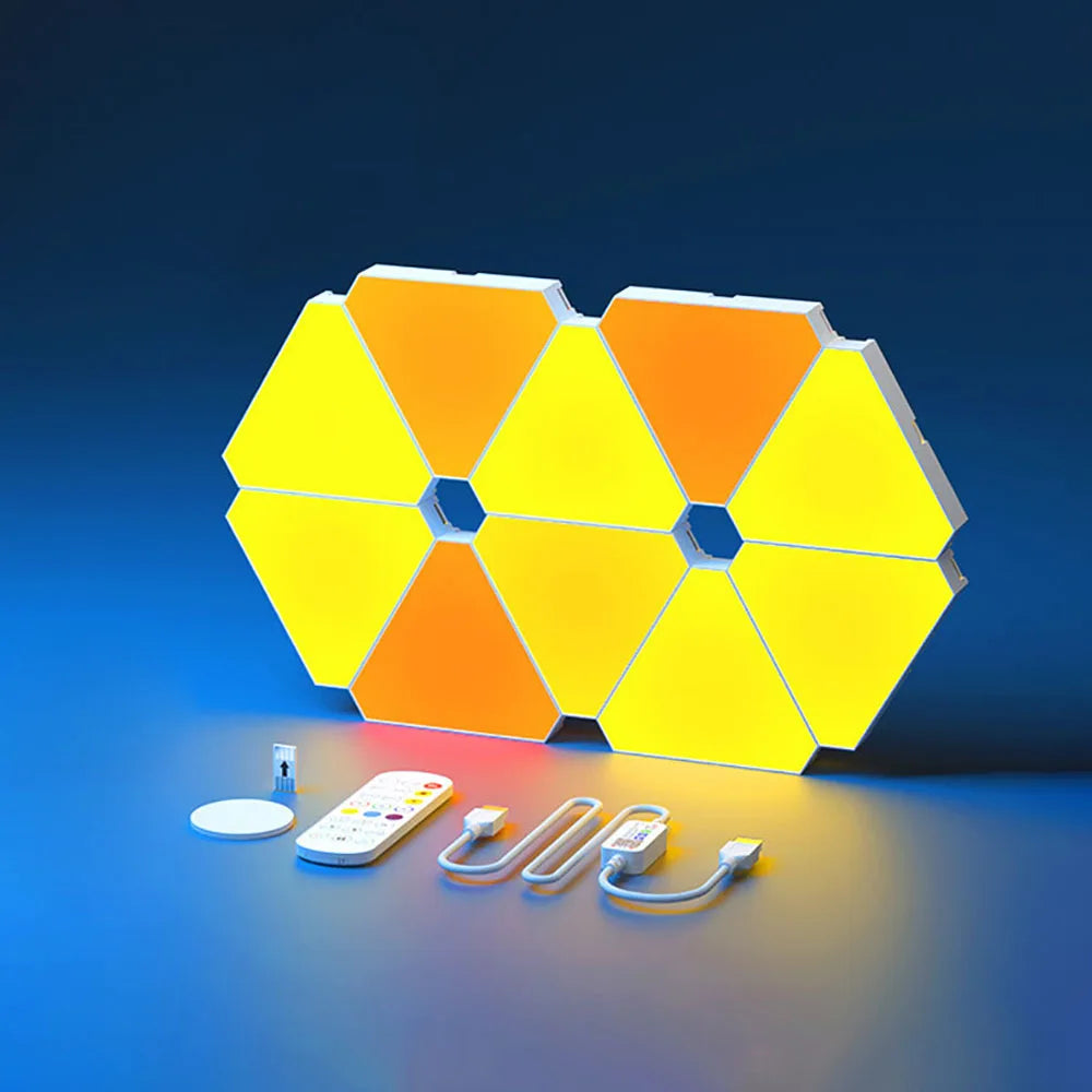 LED Triangular Quantum Lamp RGB wall lamp with remote and USB cables on blue background