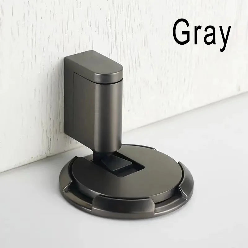 gray windproof door stopper with oil rubbed bronze finish mounted on white wall and floor