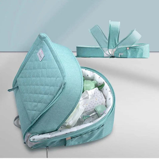 Portable baby diaper bag backpack with changing pad and baby bottles storage in teal color
