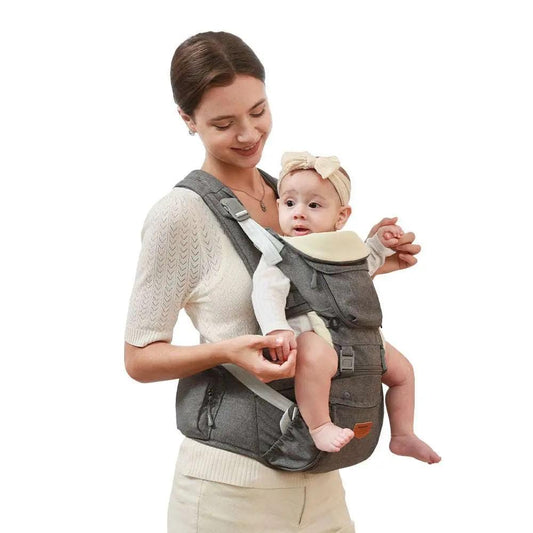 Ergonomic baby carrier with adjustable straps and hipseat holding baby securely on smiling woman