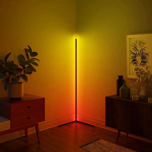 RGBCW Corner Floor Lamp with RGB color and warm light illuminating a cozy corner in a living room