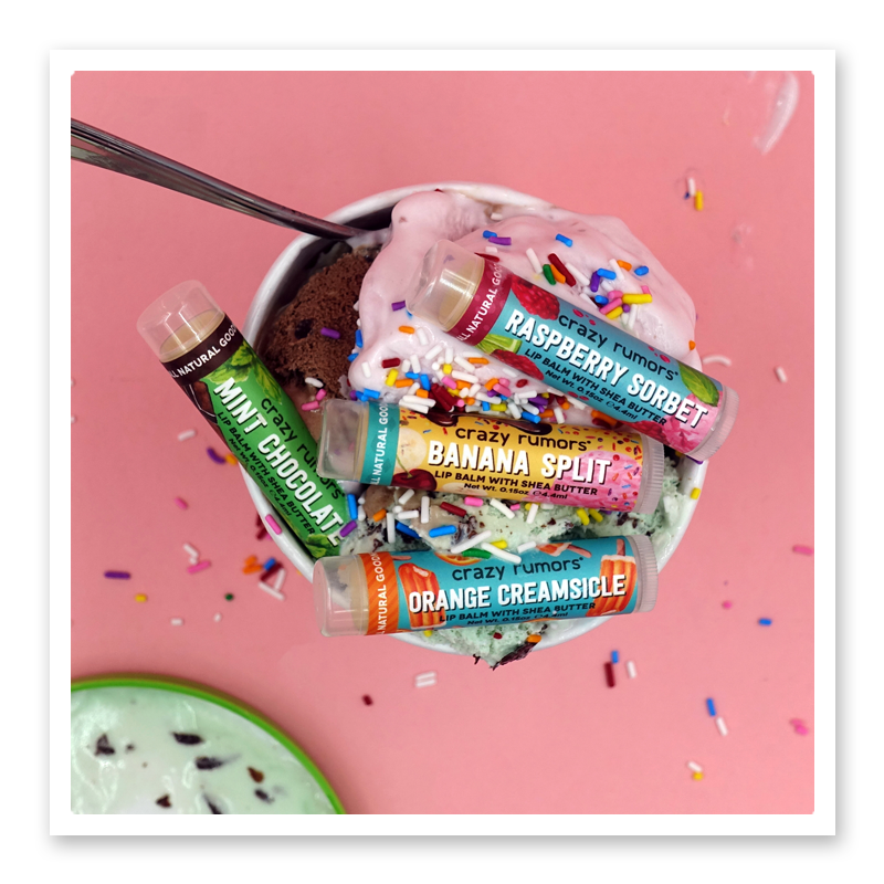 Ice Cream Mix 4 pack lip balm set with Orange Creamsicle, Banana Split, Raspberry Sorbet, and Mint Chocolate flavors in a dessert-themed display
