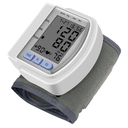 Digital wrist blood pressure monitor with LCD display and automatic memory function