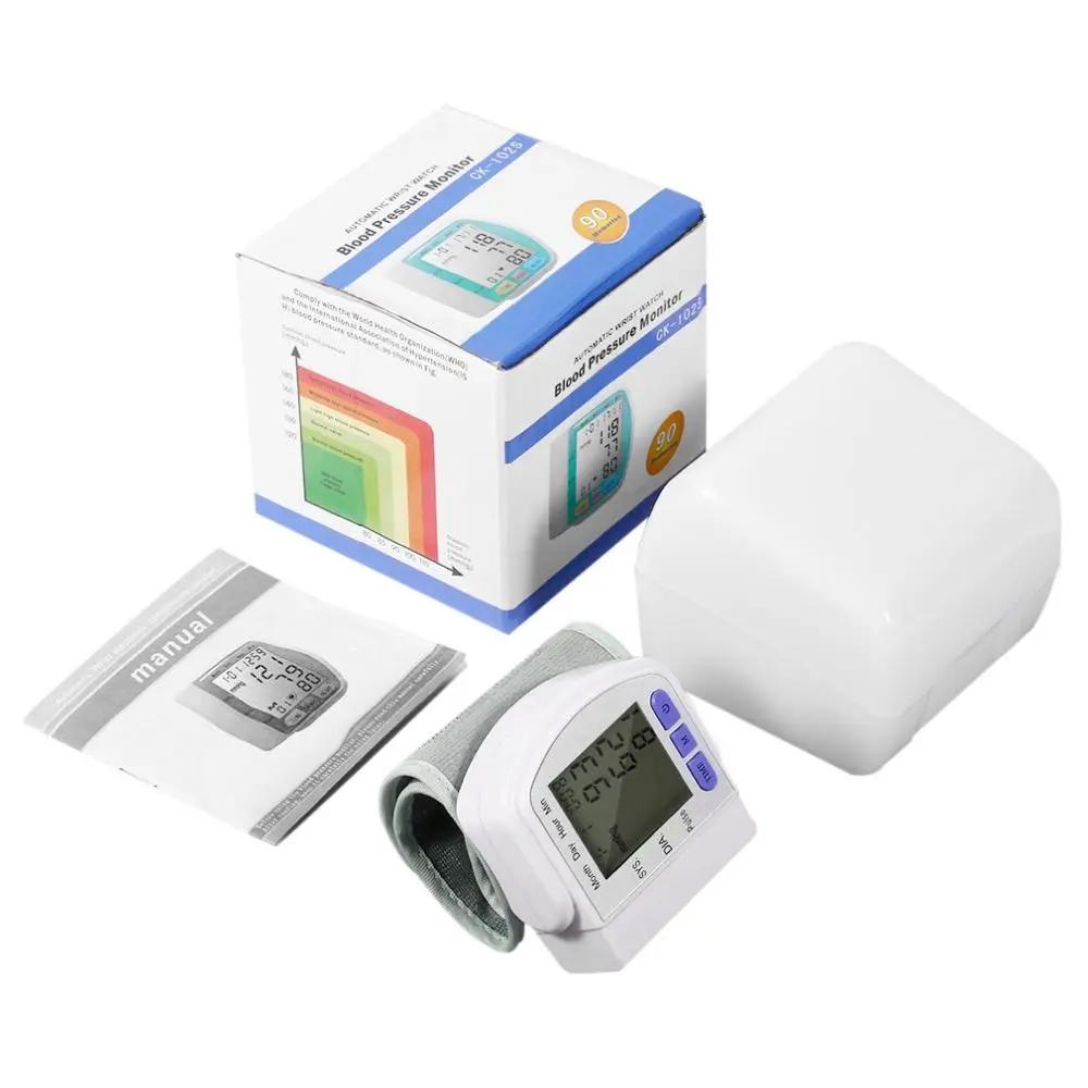 Digital wrist blood pressure monitor with LCD display, wrist cuff, manual, and carrying case.