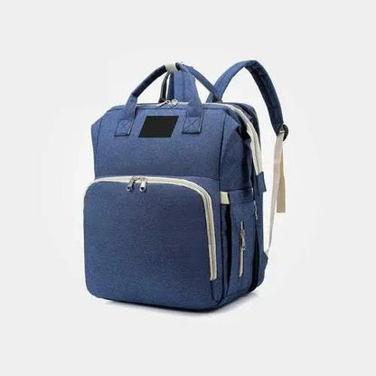 Blue nylon stroller diaper bag with baby bed mat and multiple compartments