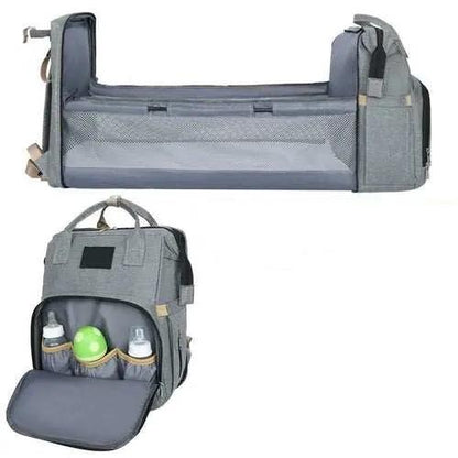 Gray nylon stroller diaper bag with baby bed mat and multiple storage compartments