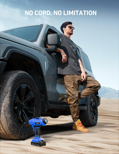 Cordless tire inflator air compressor next to an off-road vehicle with a man leaning on the car in a desert environment