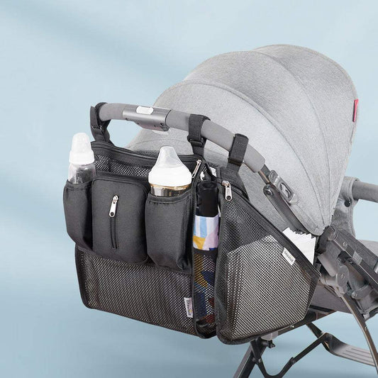 Universal stroller organizer with insulated cup holders, multiple pockets, mesh storage, waterproof and adjustable straps attached to stroller handle.