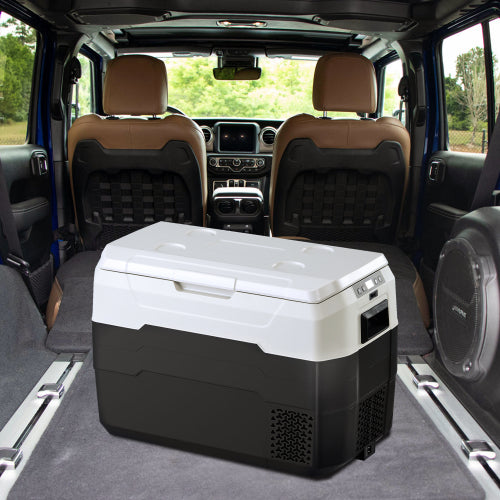 Portable car fridge cooler with digital controls inside SUV trunk for travel and camping